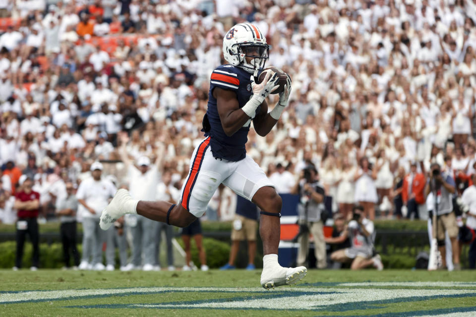 Auburn wide receiver Jay Fair catches a pass for a touchdown against Massachusetts during the second half of an NCAA college football game Saturday, Sept. 2, 2023, in Auburn, Ala. (AP Photo/Butch Dill)