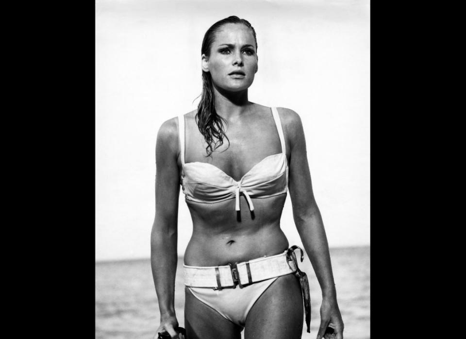 <p>One of the most memorable swimsuit scenes of all time, the first-ever Bond girl is the epitome of a beach babe — her flirty lashes perfectly offset with a knife belt.</p>