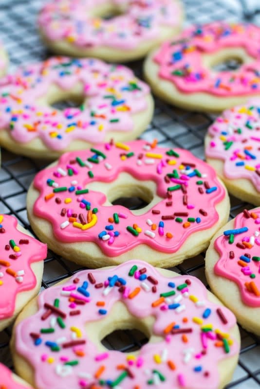<p>Veronika's Kitchen</p><p>Donut sugar cookies topped with icing and sprinkles are the best recipe for soft cut out sugar cookies made from scratch!</p><p><strong>Get the recipe: <a href="https://veronikaskitchen.com/donut-sugar-cookies/" rel="nofollow noopener" target="_blank" data-ylk="slk:Donut Sugar Cookies;elm:context_link;itc:0;sec:content-canvas" class="link rapid-noclick-resp"><em>Donut Sugar Cookies</em></a></strong></p>