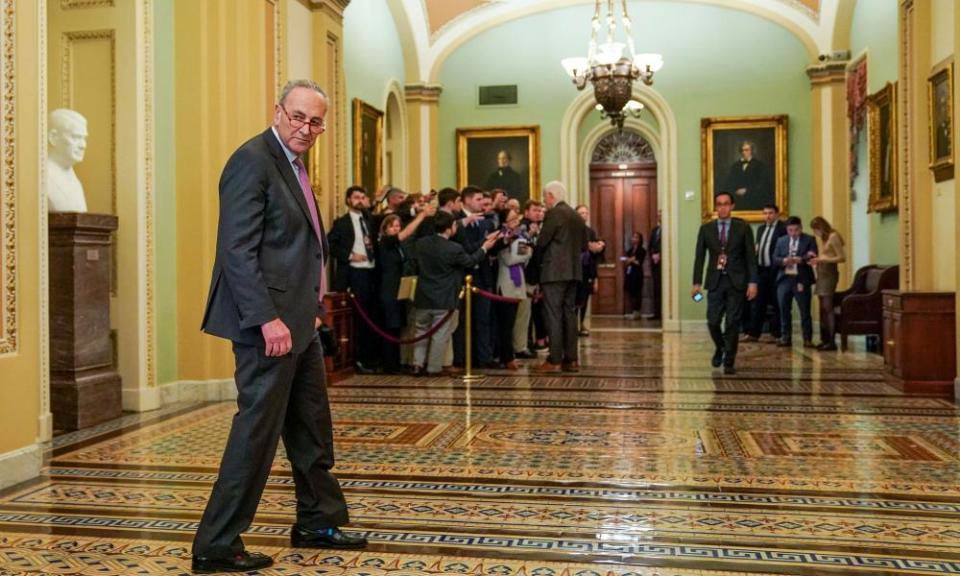 Chuck Schumer walks outside the Senate chamber during break in the trial.