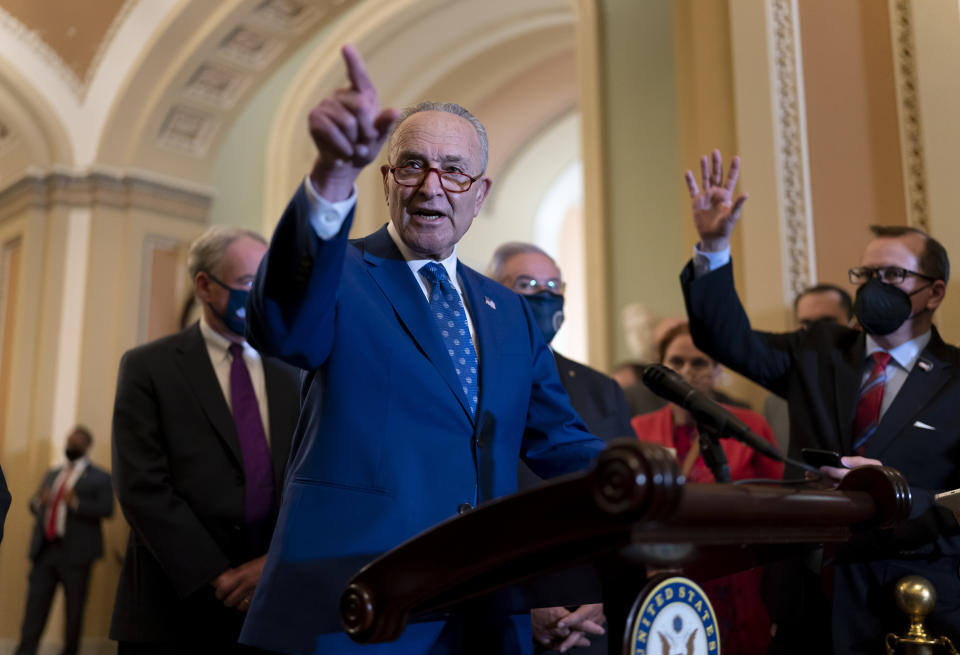 Senate Majority Leader Chuck Schumer, D-N.Y., speaks to reporters following a Democratic strategy meeting, at the Capitol in Washington, Tuesday, Nov. 16, 2021. (AP Photo/J. Scott Applewhite)