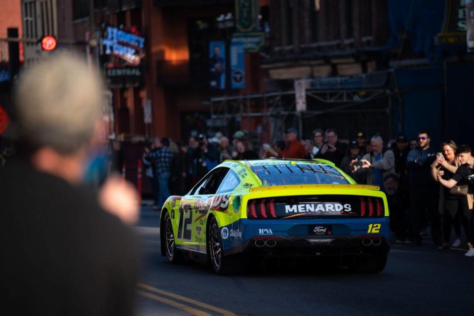 2023 NASCAR Points Champion Ryan Blaney (12) cruises along Lower Broadway during the NASCAR Champions Car Parade in Nashville, Tenn., Wednesday, Nov. 29, 2023.