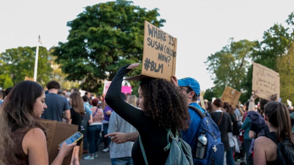 A pro-choice demonstrator holds up a sign as they attend an abortion rights rally at the U.S. Supreme Court Building in response to the leaked Supreme Court draft decision to overturn Roe v. Wade May 3, 2022 in Washington, DC. (Photo by Anna Moneymaker/Getty Images)