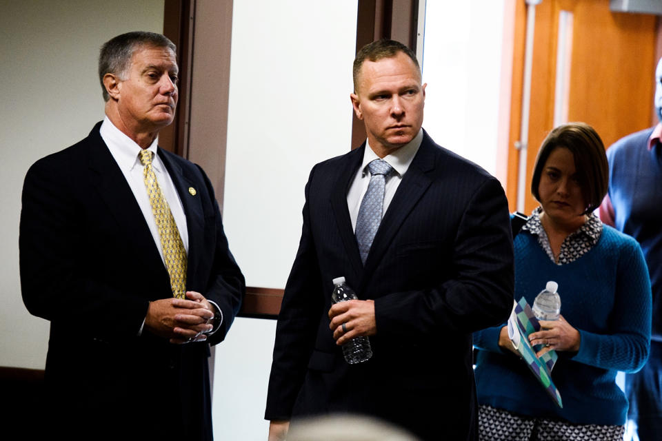 Suspended Greenville Sheriff Will Lewis enters the courtroom with his wife, Amy, Thursday afternoon, Oct. 24, 2019, in Greenville, S.C. Lewis, 43, said he did not plan to have sex with his young female assistant at an out-of-town budget conference, but one thing led to another after they went out for drinks and ended up in her hotel room.(Josh Morgan/The Greenville News via AP, Pool)