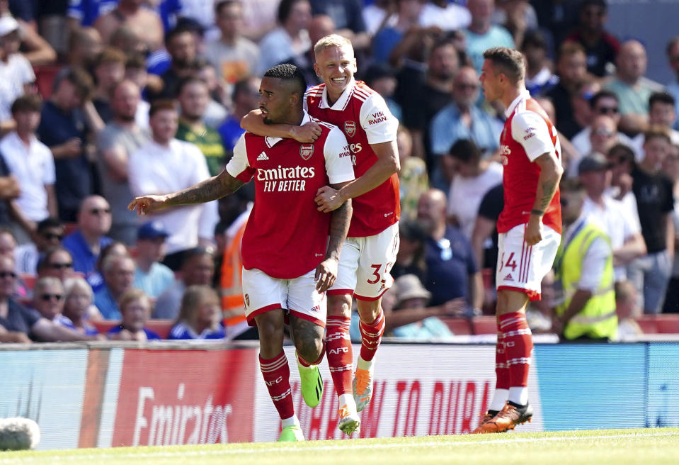 Arsenal's Gabriel Jesus, left, celebrates scoring their side's first goal of the game with team-mates Oleksandr Zinchenko and Granit Xhaka, right, during their English Premier League soccer match at the Emirates Stadium, London, Saturday, Aug. 13, 2022. (Mike Egerton/PA via AP)