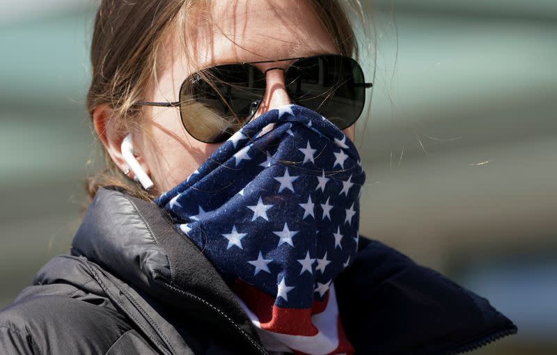 A woman wears a stars and stripes bandana for a face mask in Washington