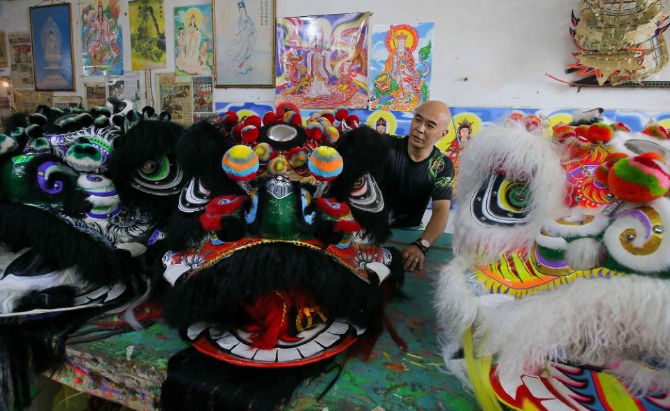 Teh Wing Liang started making lion and dragon heads in after completing his secondary education in 1994. ― Pictures by Farhan Najib