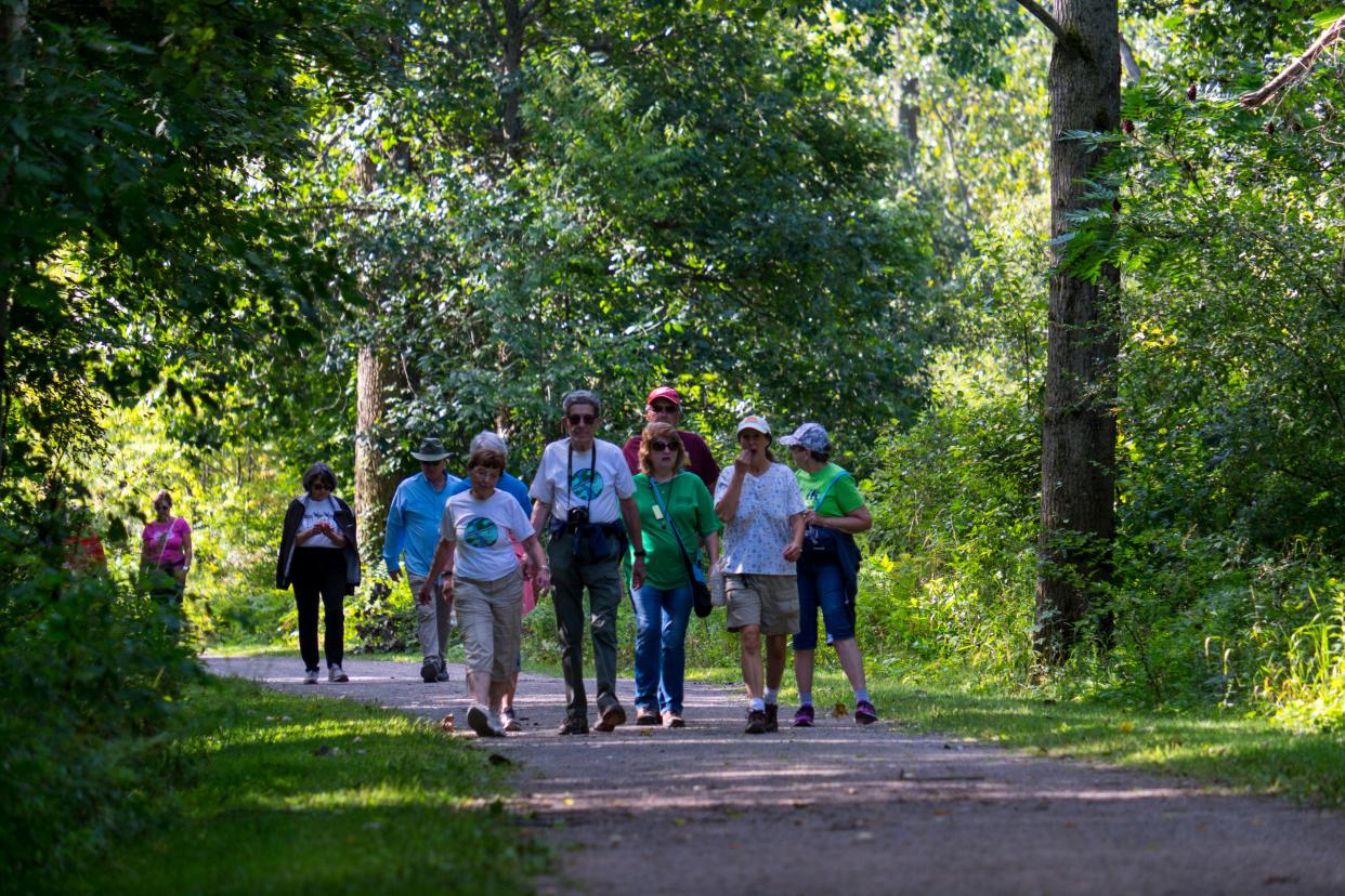 People walk along the Wadhams-to-Avoca Trail Monday, Sept. 2, 2019, during the annual Trek the Trestle Labor Day Walk.