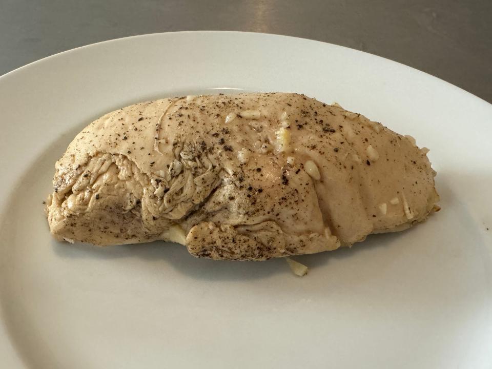sous vide chicken breast on a white plate