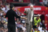 FILE - Manchester United's head coach Erik ten Hag, right, gestures with Arsenal's manager Mikel Arteta during the English Premier League soccer match between Manchester United and Arsenal at the Old Trafford Stadium in Manchester, England, on May 12, 2024. (AP Photo/Dave Thompson, File)