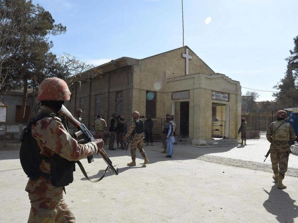Pakistani security personnel take position after suicide bombers attacked a Methodist church during a Sunday service in Quetta, Pakistan (Banaras Khan/AFP/Getty)