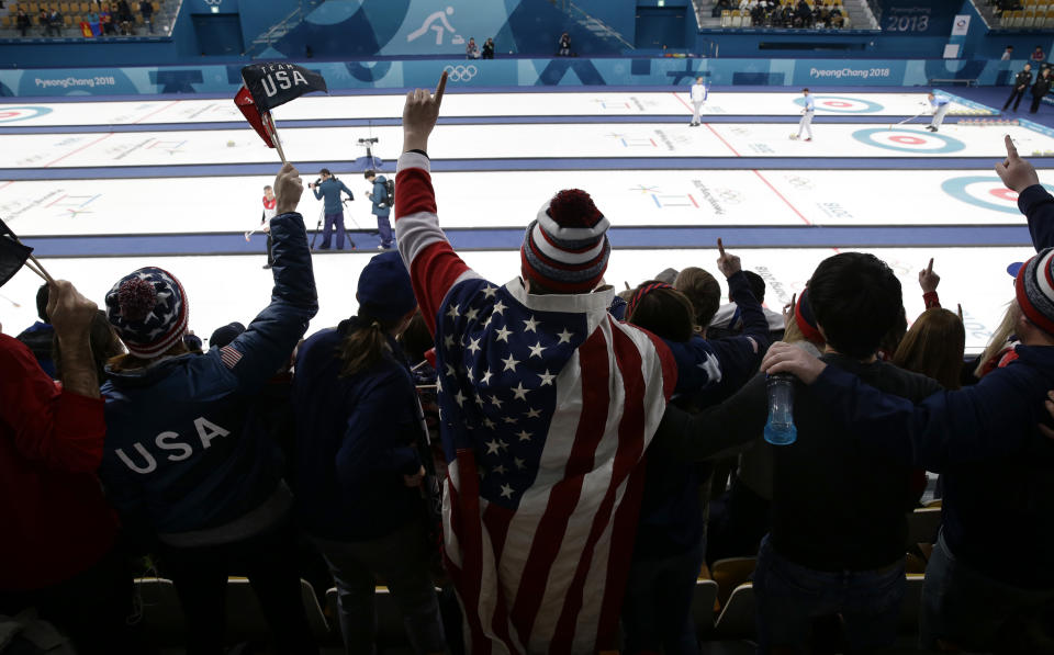 A fan wearing the American flag cheers during the men’s curling semi-final match between United States and Canada at the 2018 Winter Olympics in Gangneung, South Korea, Thursday, Feb. 22, 2018. United States won. (AP Photo/Aaron Favila)