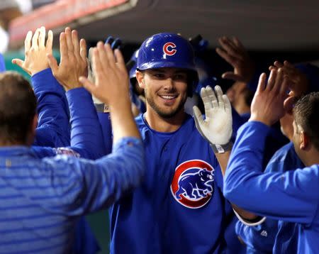 Apr 21, 2016; Cincinnati, OH, USA; Chicago Cubs third baseman Kris Bryant is congratulated by teammates after hitting a grand slam against the Cincinnati Reds during the seventh inning at Great American Ball Park. David Kohl-USA TODAY Sports