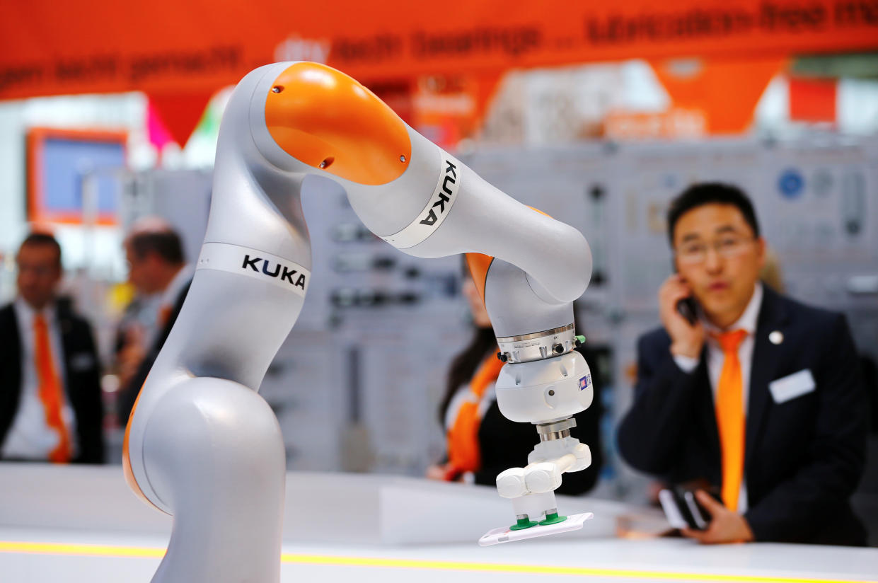 A robot arm of German industrial robot maker Kuka is pictured at the company's stand during the Hannover Fair in Hanover, Germany, April 25, 2016.    REUTERS/Wolfgang Rattay