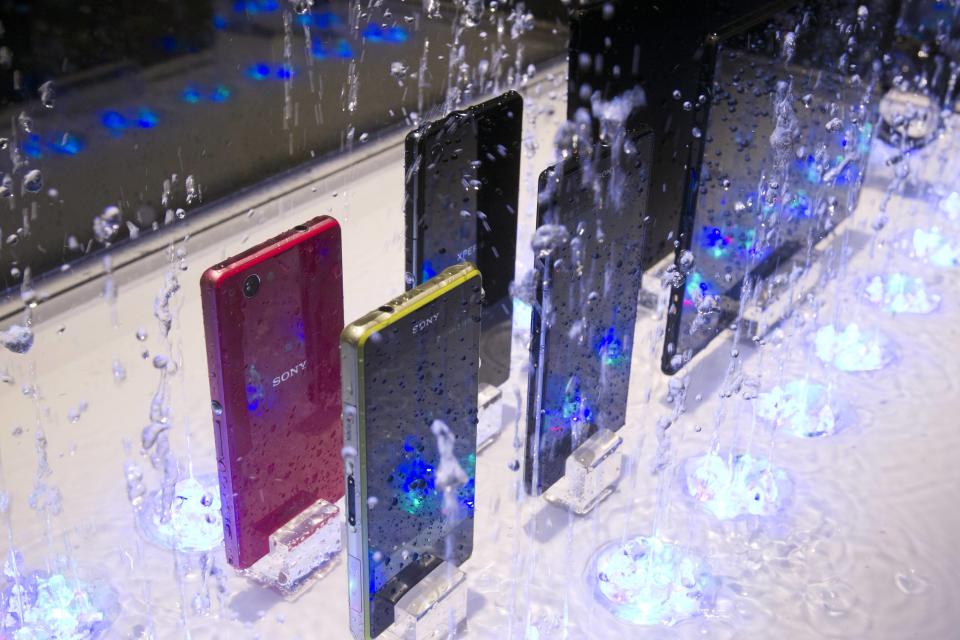 Water splashes around a display of waterproof Sony smartphones and tablets during the 2014 International Consumer Electronics Show (CES) in Las Vegas