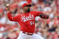 Cincinnati Reds' Tony Santillan throws during the first inning of a baseball game against the Colorado Rockies in Cincinnati, Sunday, June 13, 2021. (AP Photo/Aaron Doster)