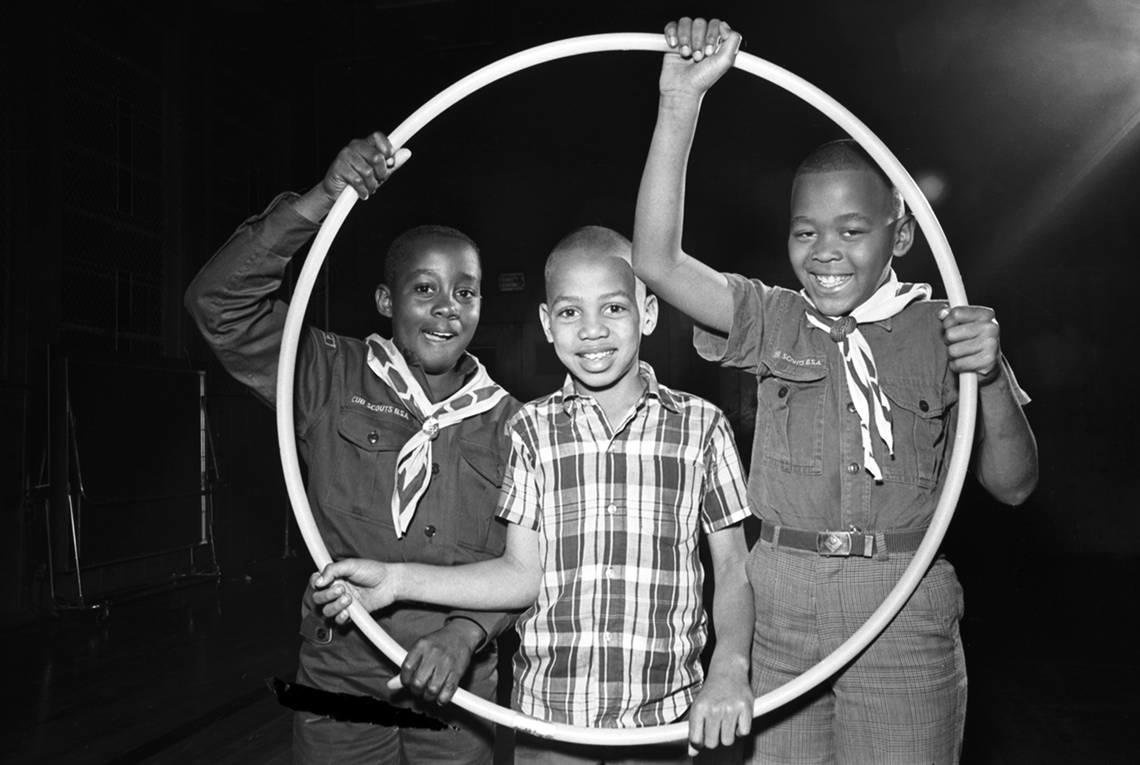 A group of Cub Scouts from Cub Scout Pack 231, represented by Kirkpatrick Elementary school students Dale Brown, 10, Anthony Earle, 9, and Marcus Jones, 9, who won the hula hoop race at the 1968 Cub Scout Olympics. The event was held by the Woodbine Trail District Longhorn Council of the Boy Scouts which took place in Harmon Recreation Center in Fort Worth and was attended by about 100 Cub and Boy Scouts. Ron Heflin/Fort Worth Star-Telegram archive/UT Arlington Special Collections