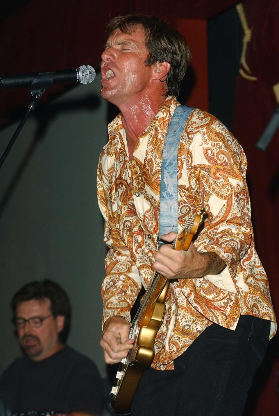 Quaid, who has been singing professionally for years, performs live with his band The Sharks August 1, 2002 in New York City (Getty Images)