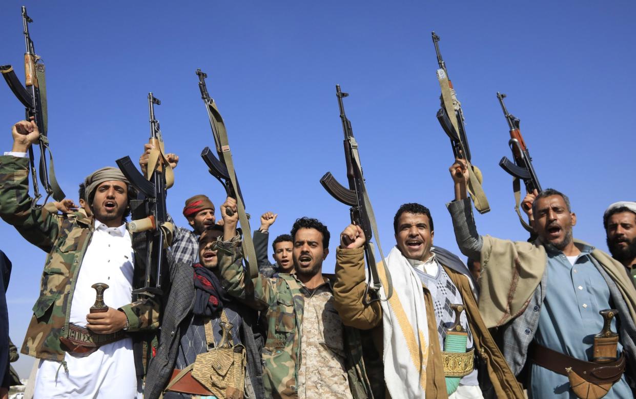 Houthi supporters rally against the USA and Israel at a rally in Sana'a, Yemen