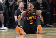 Atlanta Hawks guard Dejounte Murray (5) reacts after being fouled during the second half of an NBA basketball game against the Boston Celtics Thursday, March 28, 2024, in Atlanta. (AP Photo/John Bazemore)