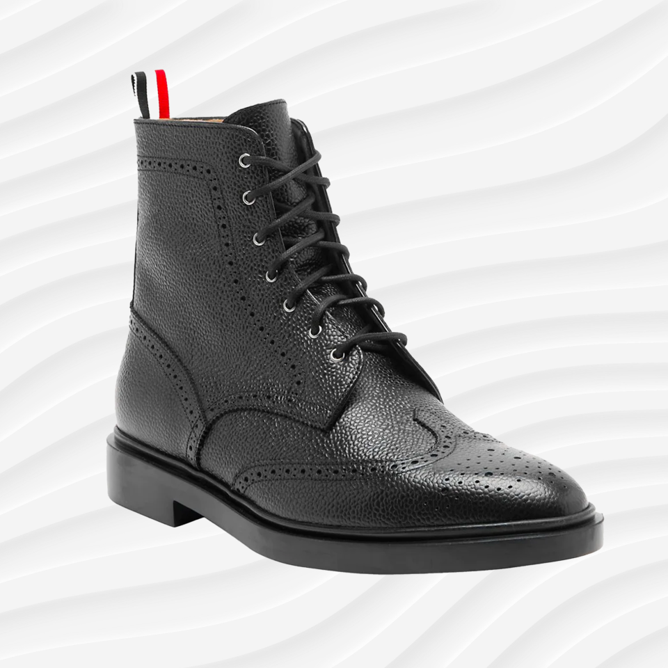 the thom browne leather wingtip boots in black on a white wavy background