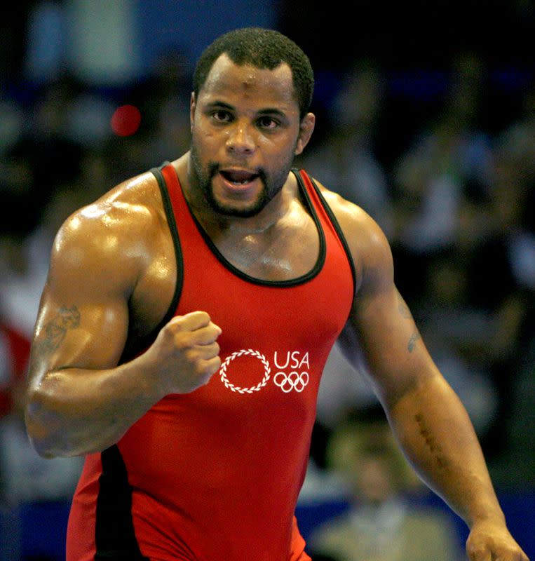 FILE PHOTO: Cormier of the U.S. celebrates winning a bronze medal during the men's Free Style 96kg finals at the Senior Wrestling World Championship in Baku