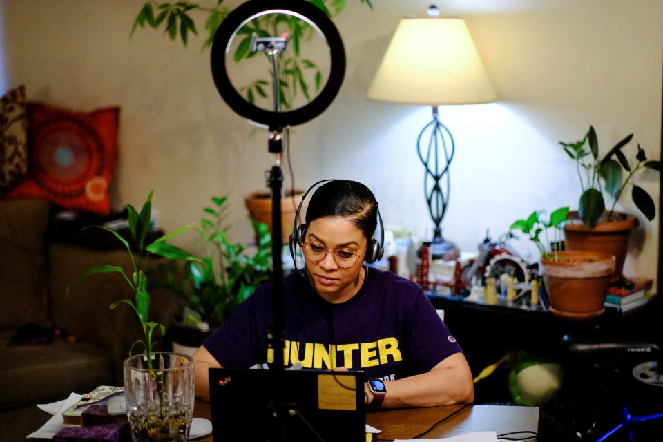 Amina Woods, program director for a foster care agency and a psychotherapist for a private practice, works at her home in New York City, U.S., March 3, 2021. 