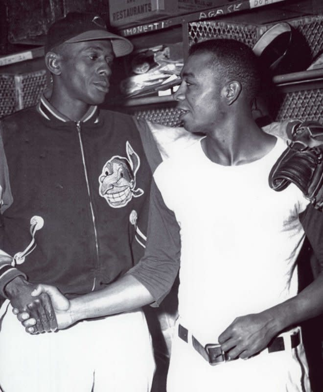 Larry Doby (R) shown with fellow former Negro Leagues star Satchel Paige, became the first Black player in Major League Baseball's American League. File Photo courtesy of the Negro Leagues Baseball Museum, Inc.