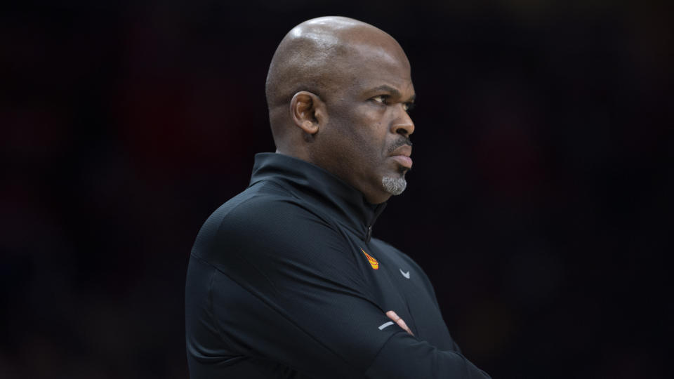 Atlanta Hawks head coach Nate McMillan watching the game during the first half of an NBA basketball game against the New York Knicks Saturday, Nov. 27, 2021, in Atlanta. (AP Photo/Hakim Wright Sr.)