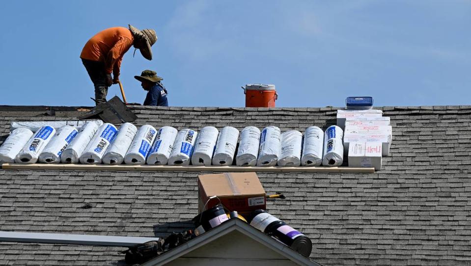 The National Weather Service has issued a heat advisory for an area including Manatee County. Roofers from KVM Roofing and Windows work atop a home in West Bradenton on Wednesday, July 5, 2023.
