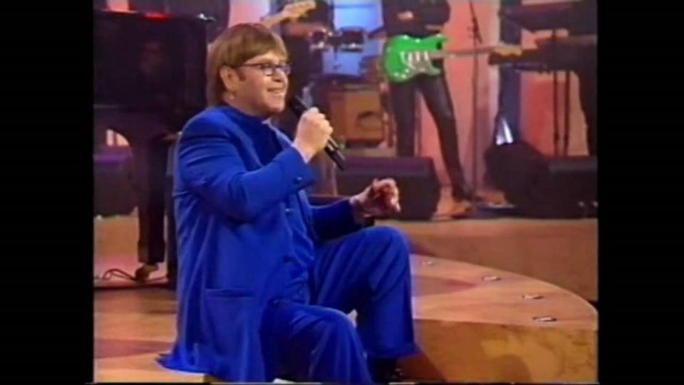 Elton John answers questions and performs for fans in his 1997 TV special. 