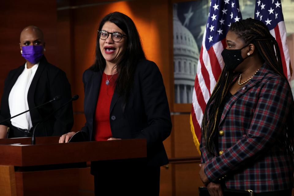 U.S. Rep. Rashida Tlaib (D-MI) (2nd L) becomes emotional as she speaks as Rep. Ayanna Pressley (D-MA) (L) and Rep. Cori Bush (D-MO) (R) look on during a news conference at the U.S. Capitol December 8, 2021 in Washington, DC.