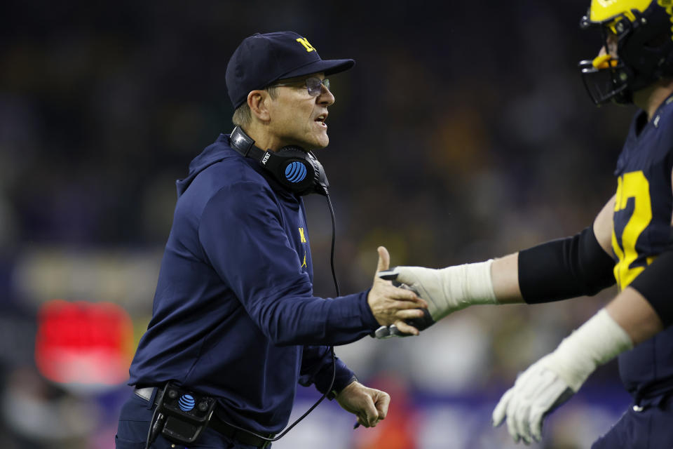 Former Michigan coach Jim Harbaugh led his team to a title last season despite missing multiple games for two separate infractions. (Joe Robbins/Icon Sportswire via Getty Images)