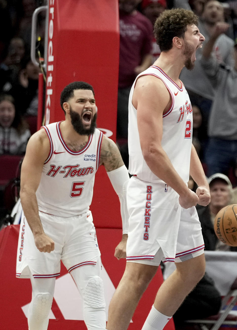 Houston Rockets center Alperen Sengun, right, reacts after making a basket and drawing a foul against the New Orleans Pelicans during the second half of an NBA basketball in-season tournament game Friday, Nov. 10, 2023, in Houston. (AP Photo/Eric Christian Smith)