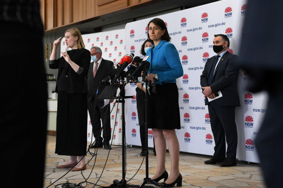 NSW Premier Gladys Berejiklian (centre) speaks to the media during a press conference to provide a COVID-19 update, in Sydney.