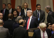 <p>United States President Donald Trump, center, makes his way through diplomats and others after a meeting during the United Nations General Assembly at U.N. headquarters, Monday, Sept. 18, 2017. (Photo: Seth Wenig/AP) </p>