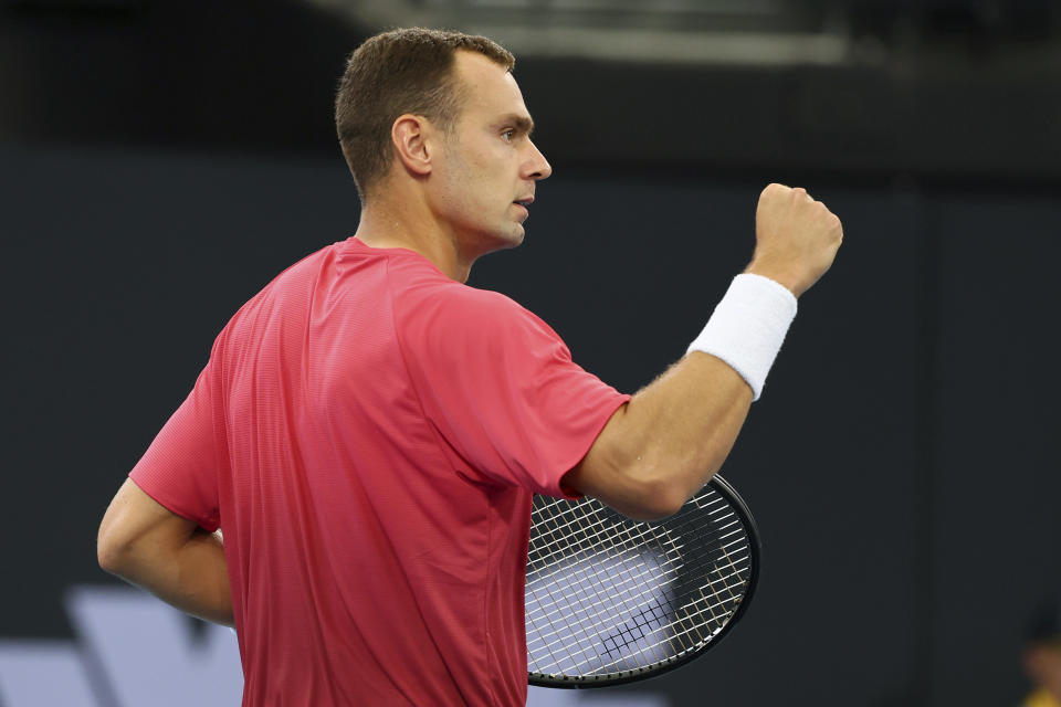 Roman Safiullin of Russia reacts after winning a point in his match against Ben Shelton of the U.S. during the Brisbane International tennis tournament in Brisbane, Australia, Monday, Jan. 1, 2024. (AP Photo/Tertius Pickard)