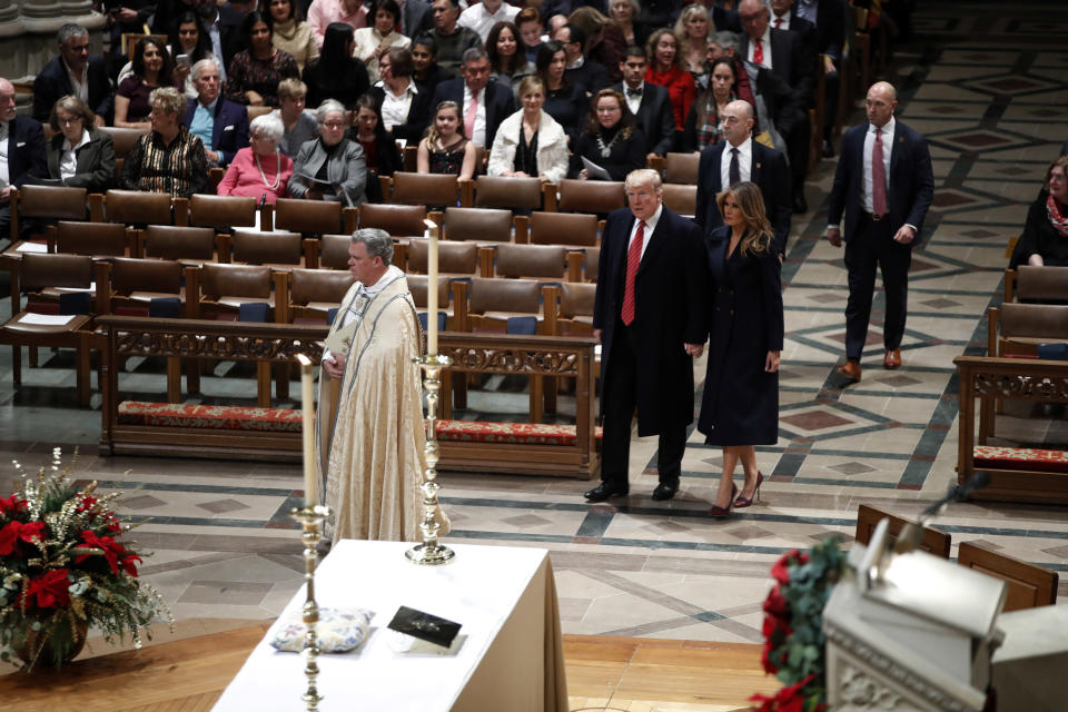 President Donald Trump and first lady Melania Trump arrive for a Christmas Eve service at the National Cathedral, Monday, Dec. 24, 2018, in Washington. (AP Photo/Jacquelyn Martin)