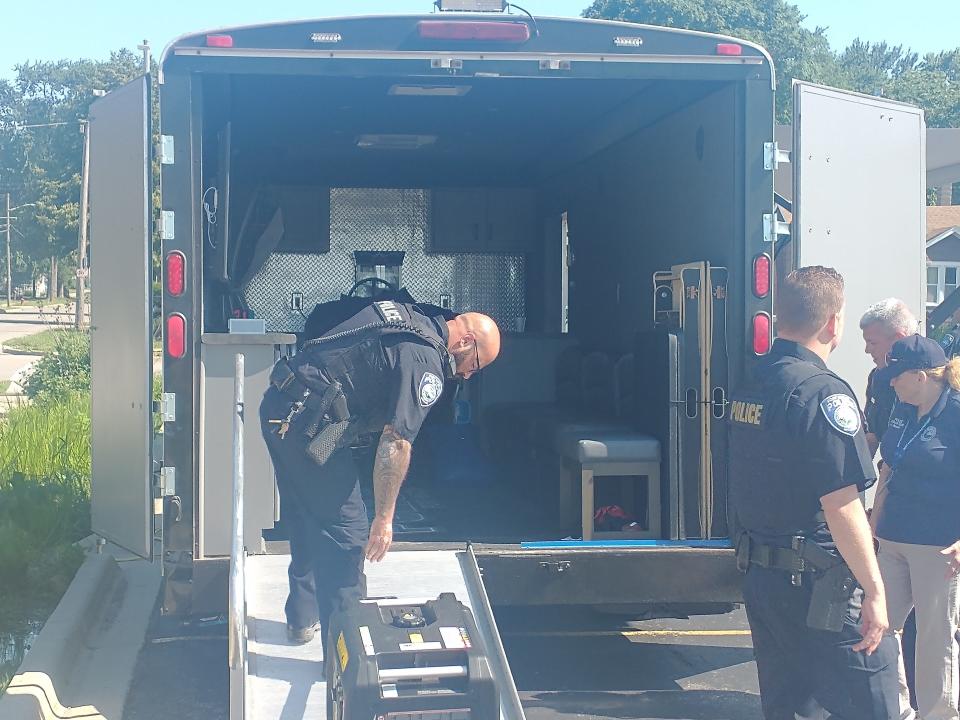 Police load equipment into the department's gaming trailer at SC4.