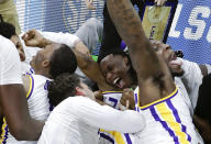 <p>LSU players celebrate after defeating Maryland 69-67 in a second-round game in the NCAA men’s college basketball tournament in Jacksonville, Fla., Saturday, March 23, 2019. (AP Photo/John Raoux) </p>