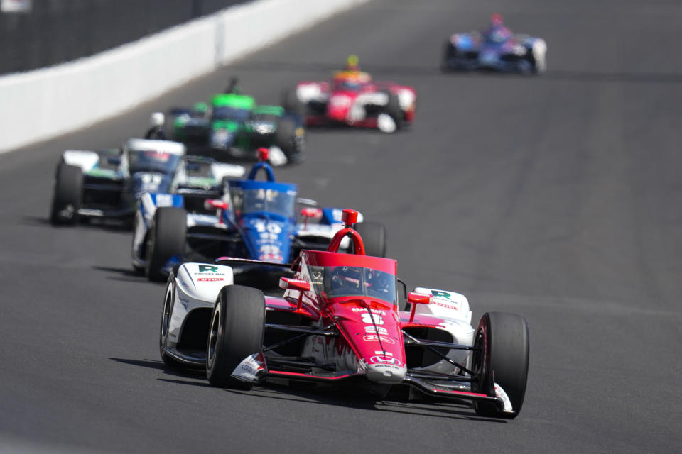 Marcus Ericsson, of Sweden, leads Alex Palou, of Spain, as they head into the first turn during the final practice for the Indianapolis 500 auto race at Indianapolis Motor Speedway in Indianapolis, Friday, May 26, 2023. (AP Photo/Michael Conroy)