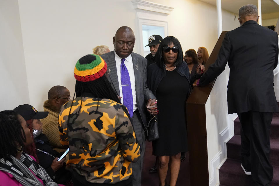 RowVaughn Wells, center, mother of Tyre Nichols, who died after being beaten by Memphis police officers, arrives at a news conference with civil rights Attorney Ben Crump in Memphis, Tenn., Monday, Jan. 23, 2023. (AP Photo/Gerald Herbert)