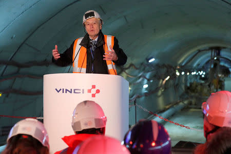 Vinci Chairman and Chief Executive Officer Xavier Huillard delivers his New Year wishes on the site of the future metro stations "Aime Cesaire" and "Mairie d'Aubervilliers" as part of the line 12 extension in Aubervilliers near Paris, France, January 16, 2018. REUTERS/Charles Platiau