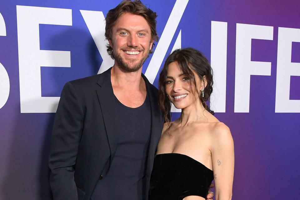 <p>Charley Gallay/Getty</p> Adam Demos and Sarah Shahi attend Netflix