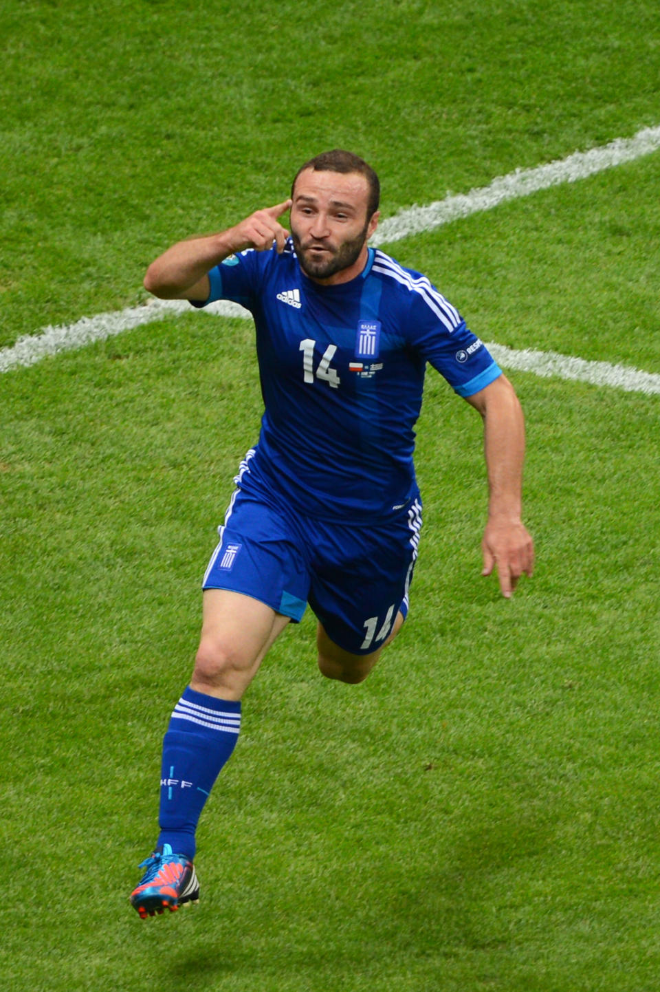 WARSAW, POLAND - JUNE 08: Dimitris Salpigidis of Greece celebrates scoring their first goal during the UEFA EURO 2012 group A match between Poland and Greece at The National Stadium on June 8, 2012 in Warsaw, Poland. (Photo by Shaun Botterill/Getty Images)