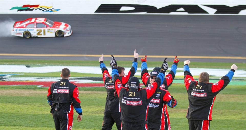 DAYTONA BEACH, FL - FEBRUARY 20: Crew members for Trevor Bayne, driver of the #21 Motorcraft/Quick Lane Ford, celebrate in pit row as Bayne performs a burnout after winning the NASCAR Sprint Cup Series Daytona 500 at Daytona International Speedway on February 20, 2011 in Daytona Beach, Florida. (Photo by Jason Smith/Getty Images for NASCAR)