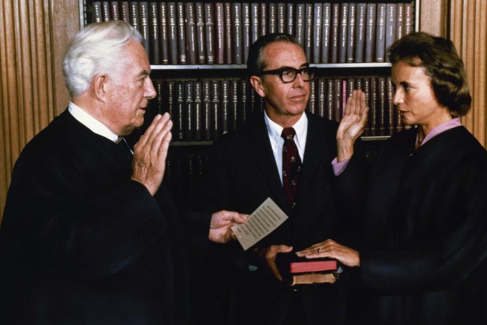 O'Connor is sworn in by Chief Justice Warren Burger in the court's conference room on 25 September 1981 (AP)