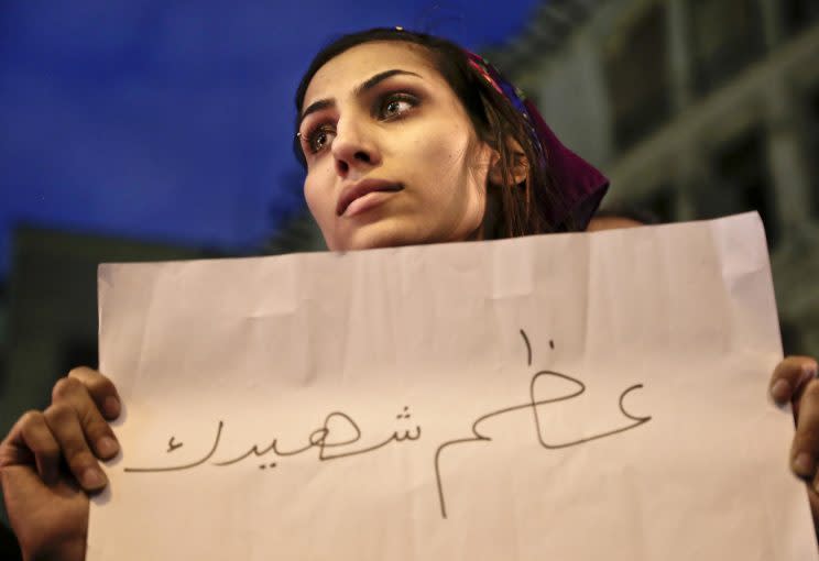 A woman during a vigil for victims in Egypt in 2016 (Rex)