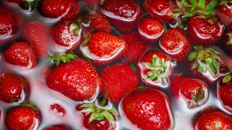 strawberries soaking in water