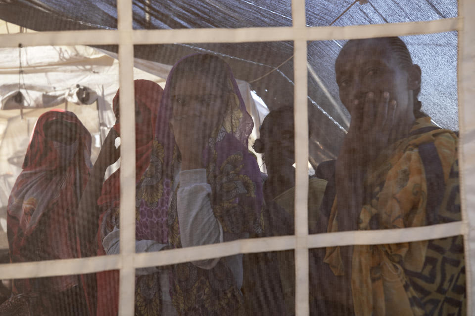 Tigray refugees who fled a conflict in the Ethiopia's Tigray region, wait their turn for treatment at a clinic run by MSF (Doctors Without Borders) in Village 8, the transit center near the Lugdi border crossing, eastern Sudan, Tuesday, Dec. 8, 2020. (AP Photo/Nariman El-Mofty)